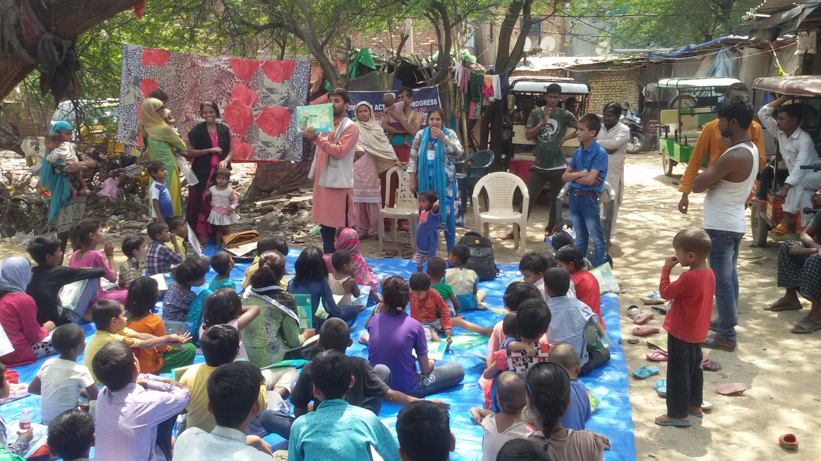Facilitators reading with children during a Bachpan Ki Shiksha session