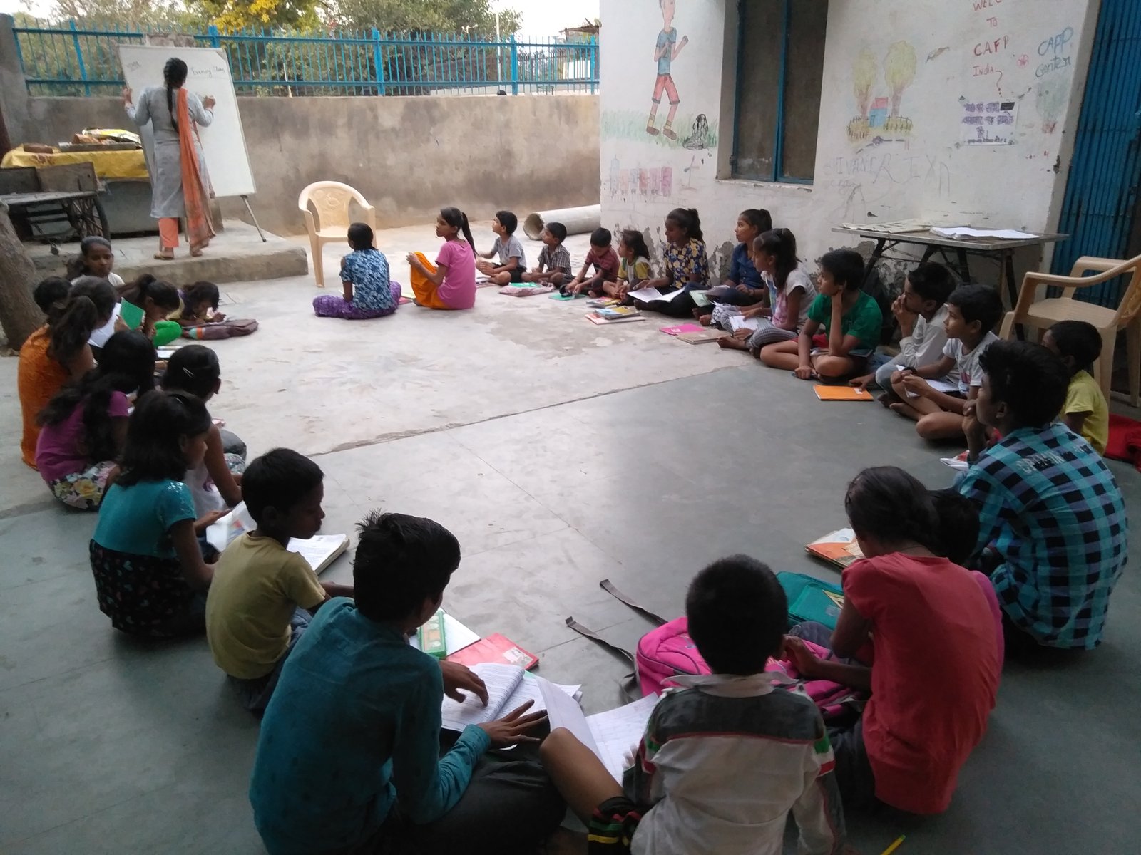 Children attending an outdoor evening class at an ARP centre