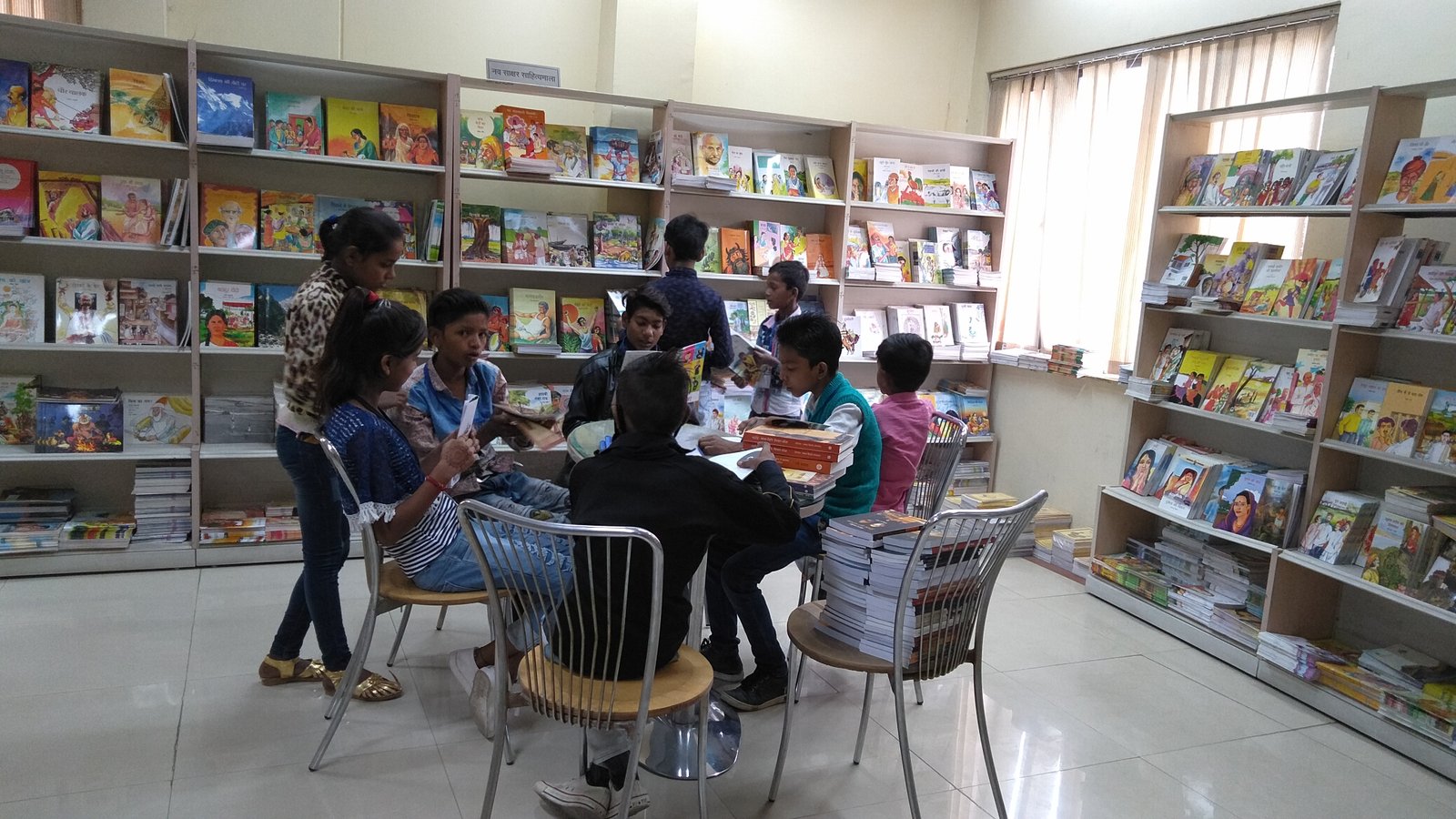 Children reading together in an ARP India centre library