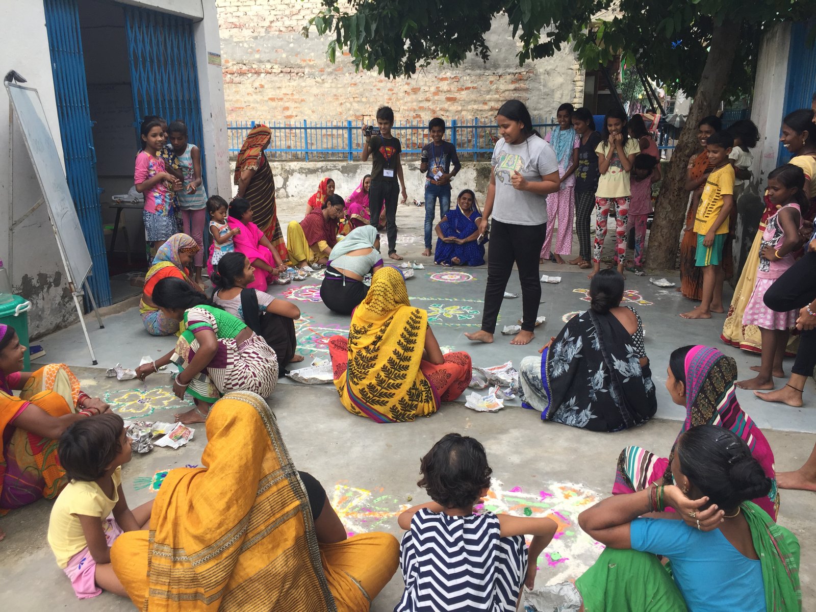 Women and children participating in a community gathering at an ARP centre